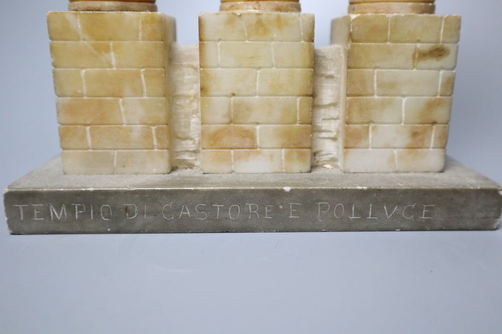 After the Antique. A Grand Tour carved and stained alabaster model of Ruins, height 34cm